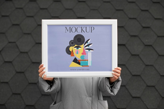 Beautiful frame model mockup held by girl