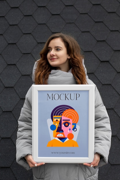 PSD beautiful frame model mockup held by girl