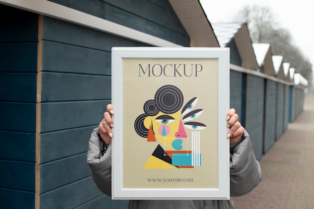 PSD beautiful frame model mockup held by girl