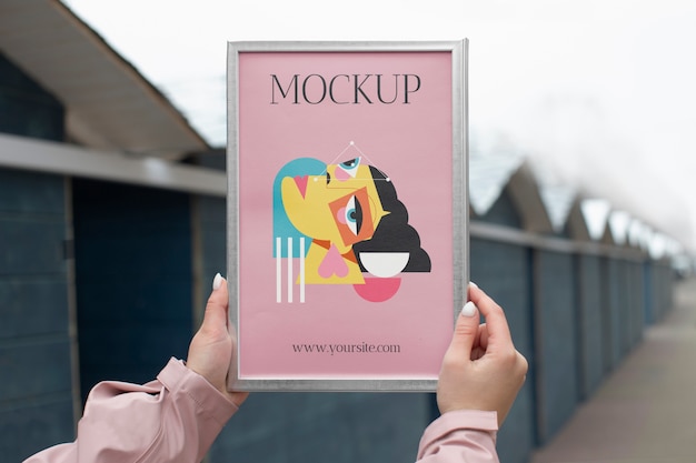 PSD beautiful frame model mockup held by girl