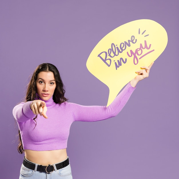 PSD beautiful model holding speech bubble