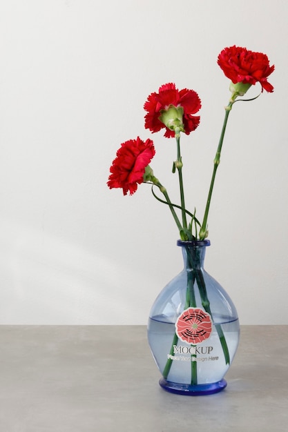 PSD beautiful red flowers in vase mockup