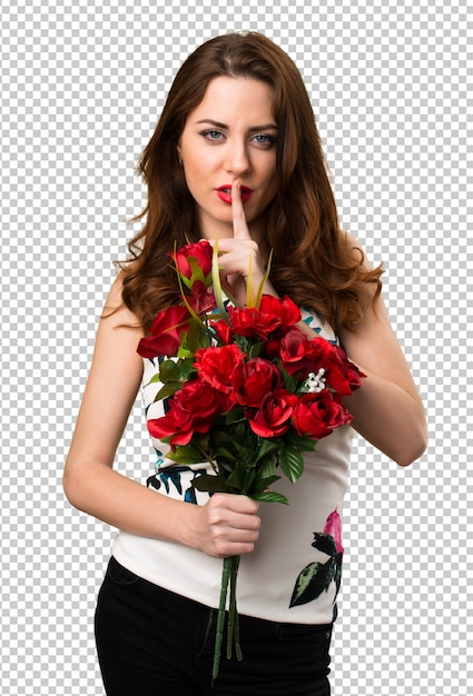 PSD beautiful young girl holding flowers making silence gesture