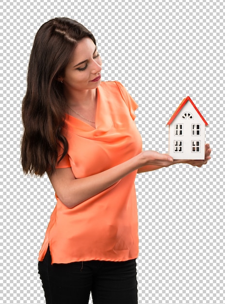 PSD beautiful young girl holding a little house