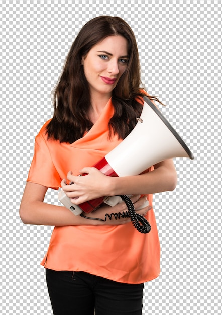 Beautiful young girl holding a megaphone