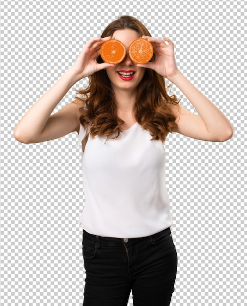 PSD beautiful young girl wearing orange slices as glasses