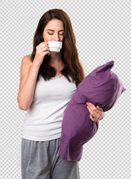 PSD beautiful young girl with a pillow holding a cup of coffee