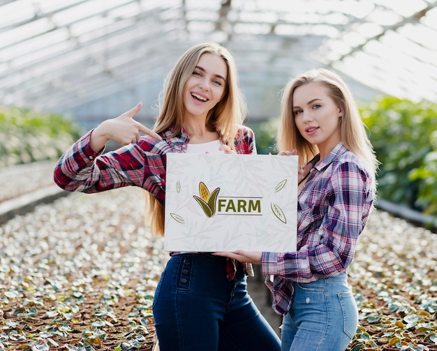 Beautiful young girls posing in a farm
