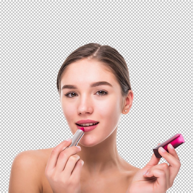 Beautiful young woman applying chapstick to lips isolated over white wall