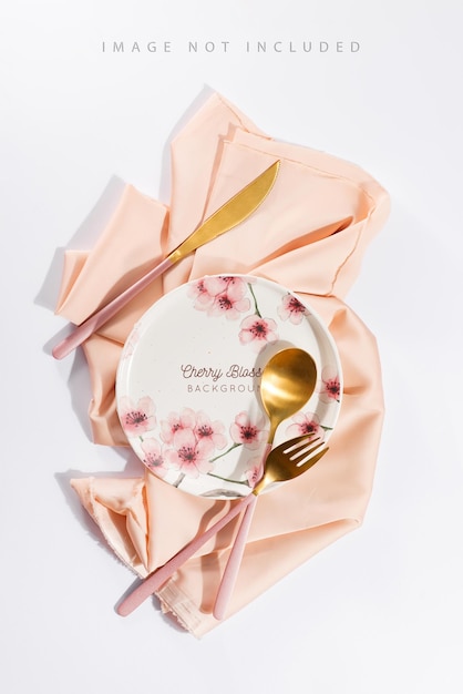 Beautifully decorated table with white plates, golden apple cutlery on luxurious beige tablecloths