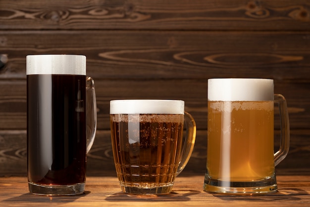 PSD beer mug mockup on wooden table