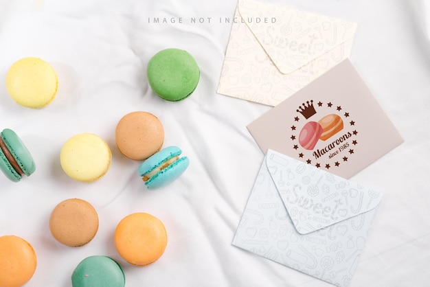 Beige macaron with dry grass and mockup letter on a silk background