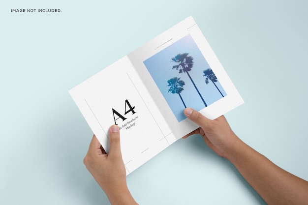 PSD bifold brochure hand-held mockup