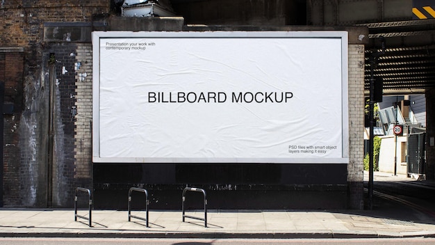 Billboard on a black bridge wall