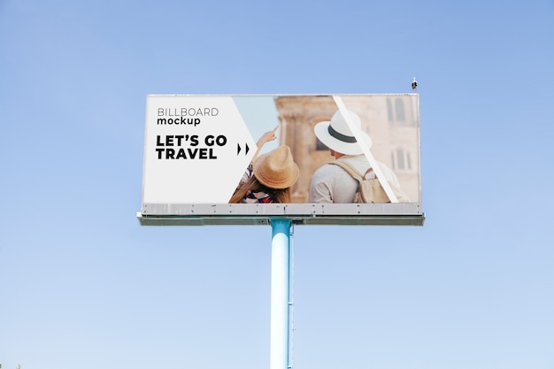 PSD billboard mockup on blue sky background