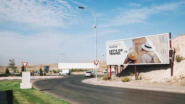 PSD billboard mockup next to road