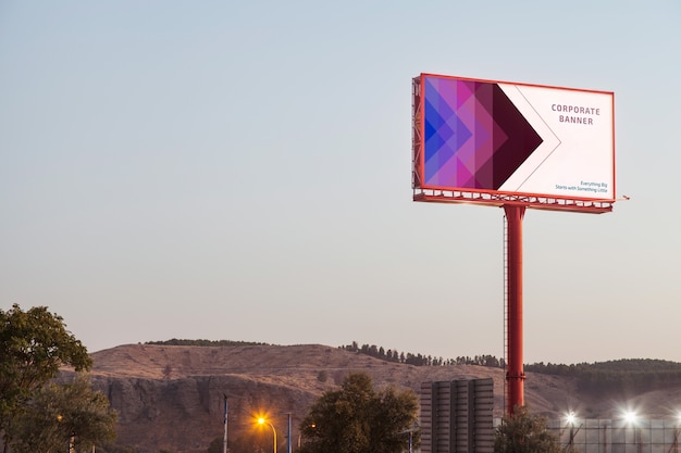 PSD billboard mockup on sunset sky