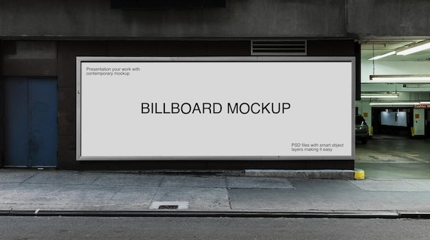 PSD billboard mockup on a wall at city street