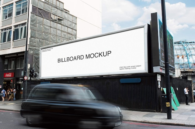 PSD billboard mockup with a building in the background