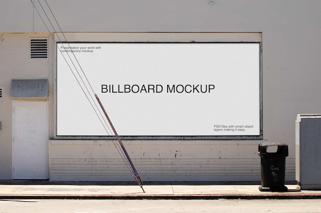 A billboard on white brick wall