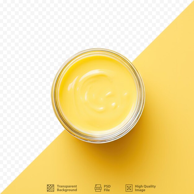 Bird s eye view of a jar of yellow paint on a black surface