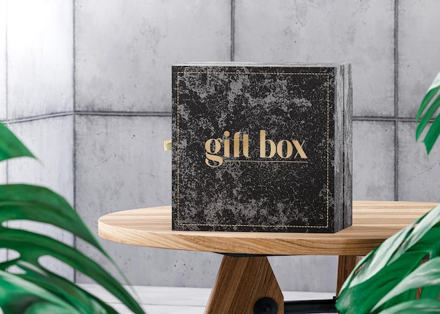 Black box present mockup for branding on a table concrete tropical background 3d render