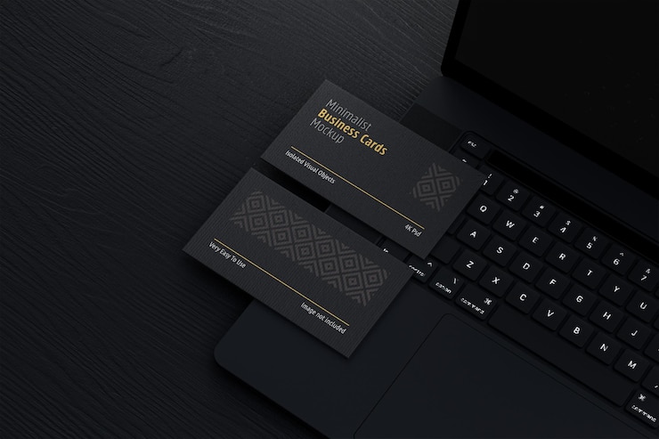 PSD black business cards mockup with laptop