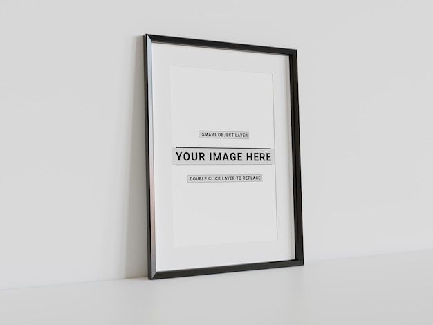 Black frame leaning on white wall mockup