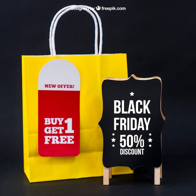 Black friday mockup with bag next to board