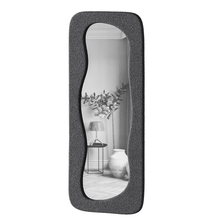 PSD a black mirror with a white frame the mirror is curved and has a black and white color scheme the room has a modern and minimalist design