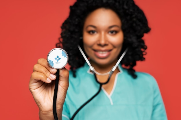 PSD black nurse holding stethoscope mockup