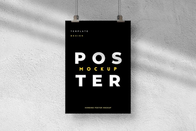 Black poster mockup with hanging effect on texture background