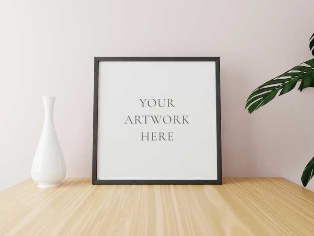 Black square frame mockup on wooden table with vase and plants. 3d rendering.