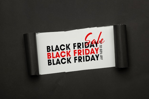 PSD black torn paper and the text black friday sale mockup