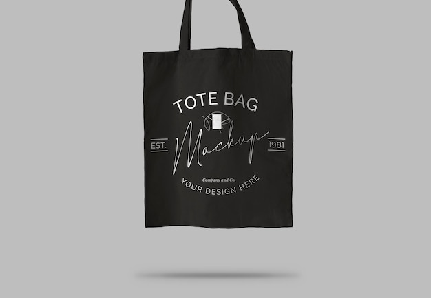 Black tote bag over light surface mockup