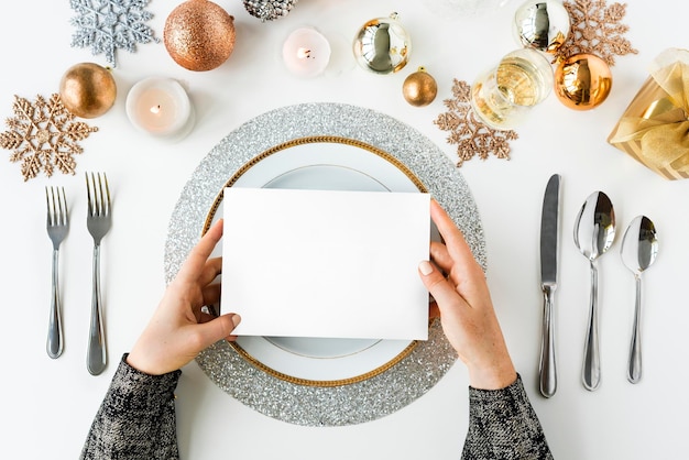 blank card on a holiday table setting