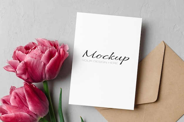 Blank greeting card mockup with envelope and tulips flowers