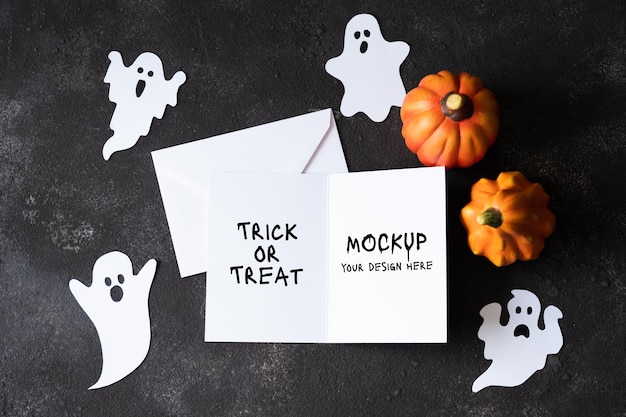 PSD blank paper card with cute ghosts on dark concrete background. template for the holiday halloween