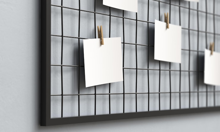 PSD blank paper hanging on metal grid board with wooden clip mock up 3d rendering