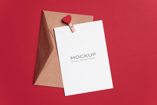 PSD blank paper valentines day card mockup with envelope on red