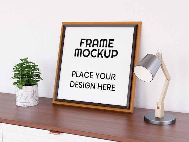 Mockup di cornice per foto in bianco sulla scrivania