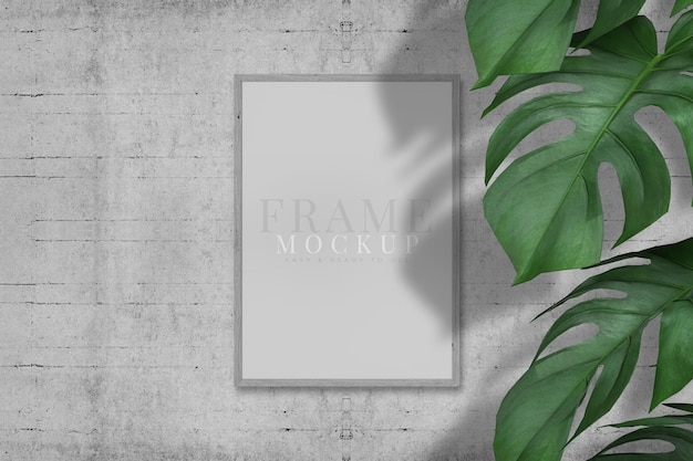 Blank picture frame for photographs art graphics with leaves frame mockup template on the background texture 3d rendering