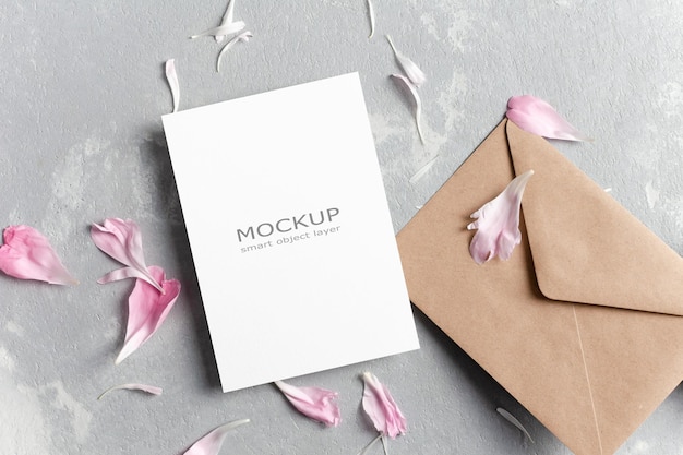 Blank wedding invitation card mockup with envelope and flowers