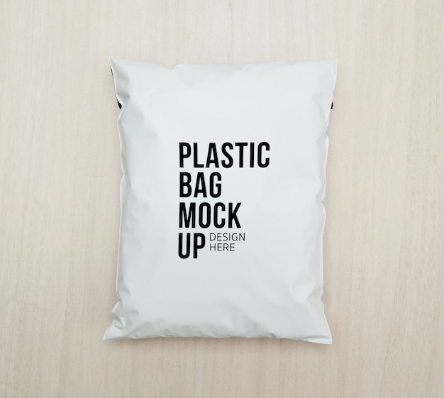 PSD blank white plastic bag package mockup template on wooden.