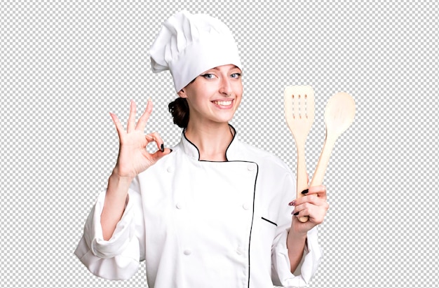 Blanke mooie blonde vrouw chef-kok concept met houten gereedschap