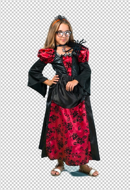 PSD blonde child dressed as a vampire for halloween holidays posing with arms at hip