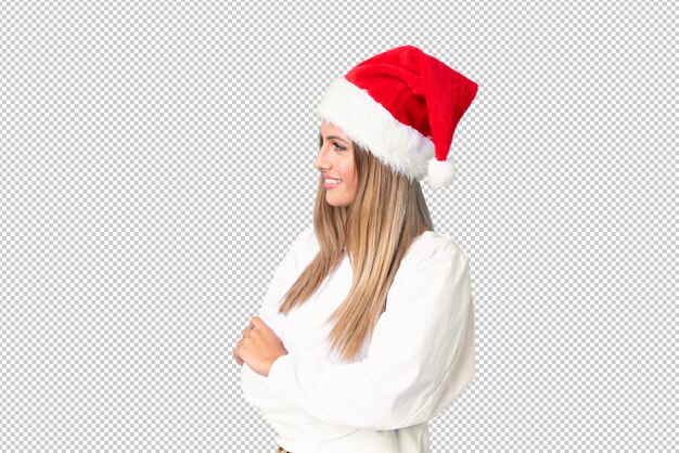 Blonde girl with christmas hat looking to the side