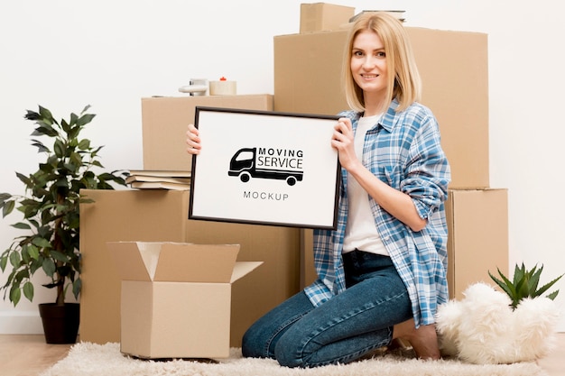 PSD blonde woman holding moving service frame