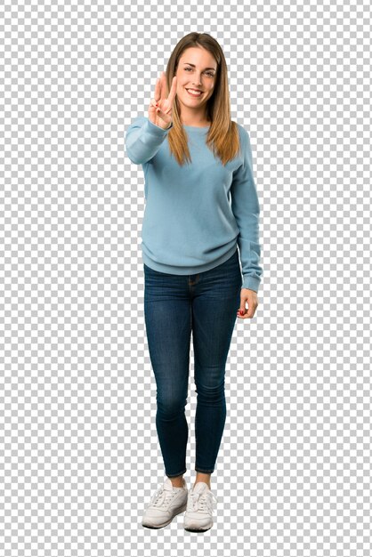 Blonde woman with blue shirt happy and counting three with fingers