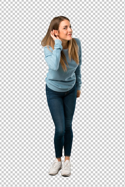 PSD blonde woman with blue shirt listening to something by putting hand on the ear